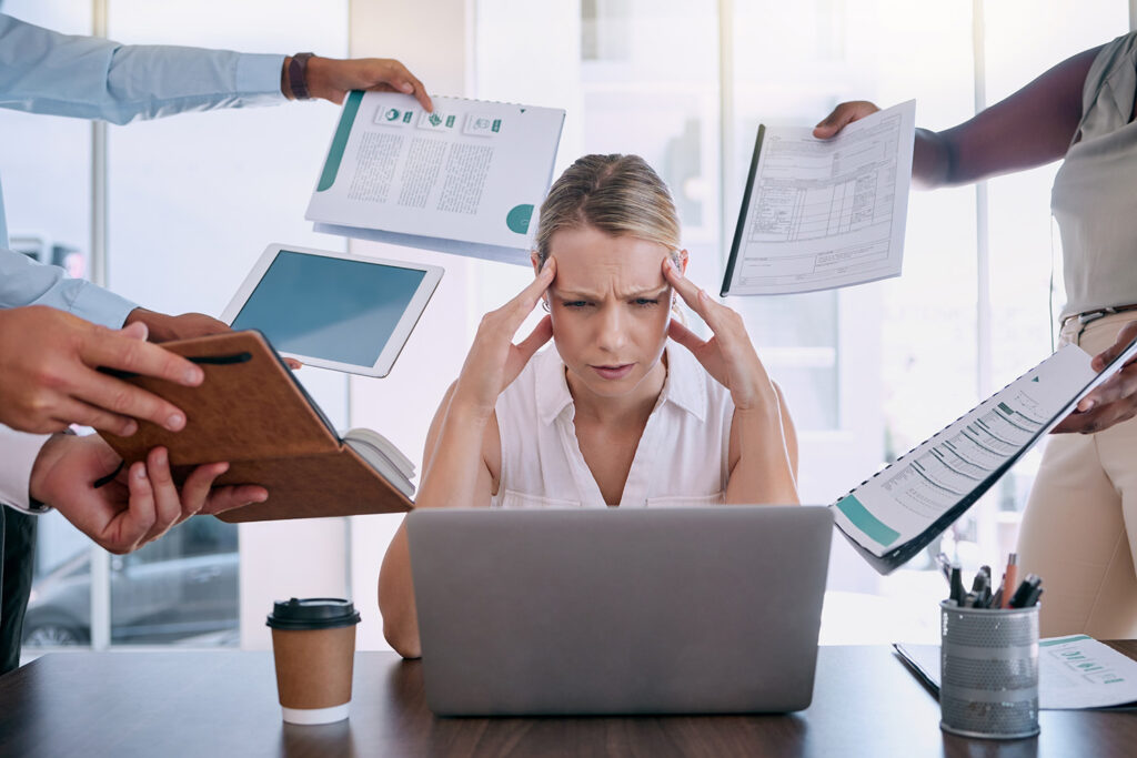 Business woman overwhelmed with business operations and business compliance issues